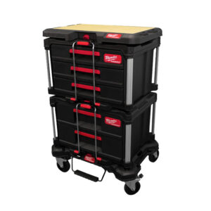 Milwaukee PACKOUT Rolling Tool Box 48-22-8426 in red and black with telescoping handle extended and all-terrain wheels on job site